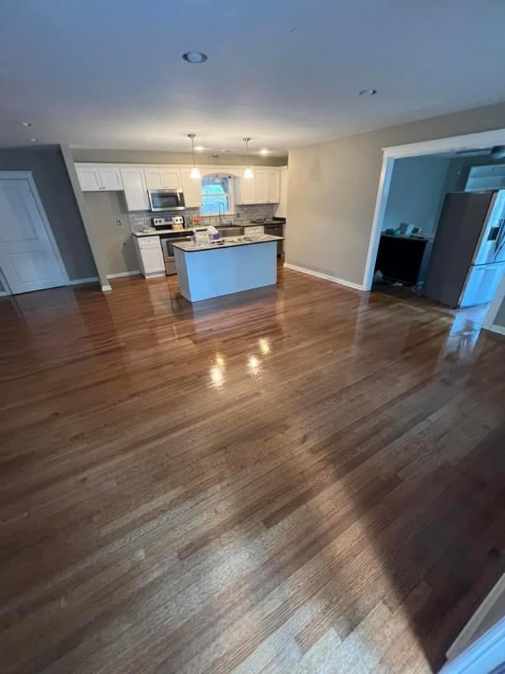 Kitchen and living area after — stunning glossy refinished hardwood